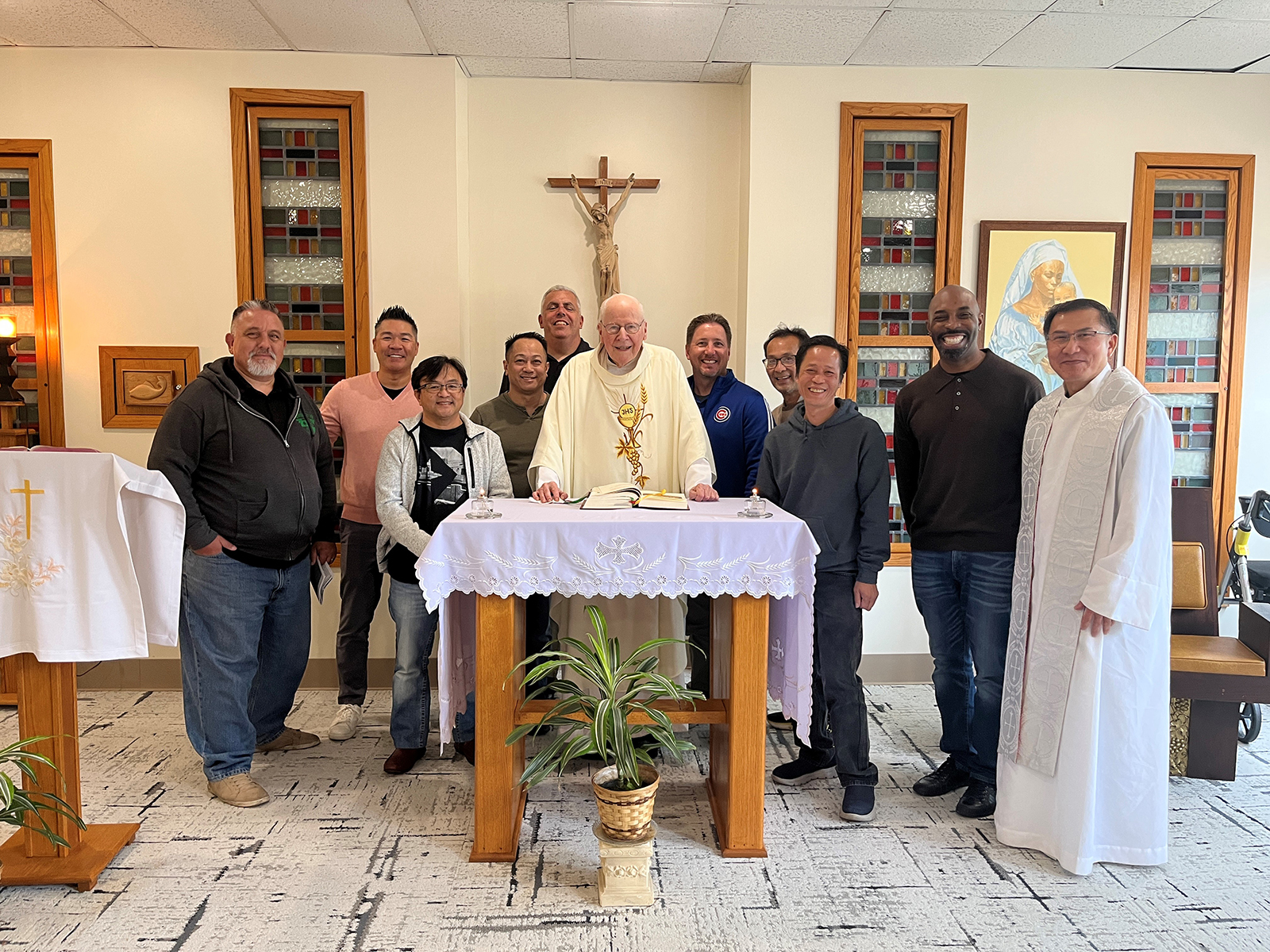 A group of Divine Word Alumni pose for a photo