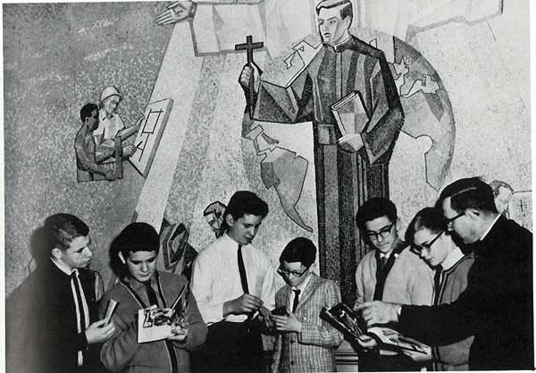 Young seminary students standing beneath mosaic of missionary priest