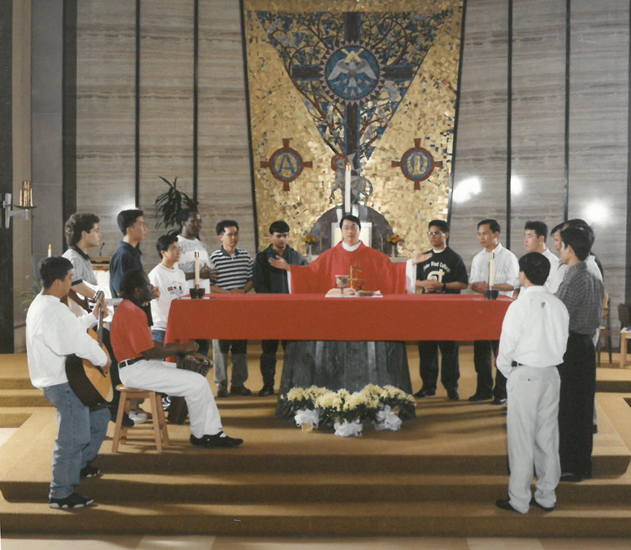 Men gathered around the altar during Catholic Mass