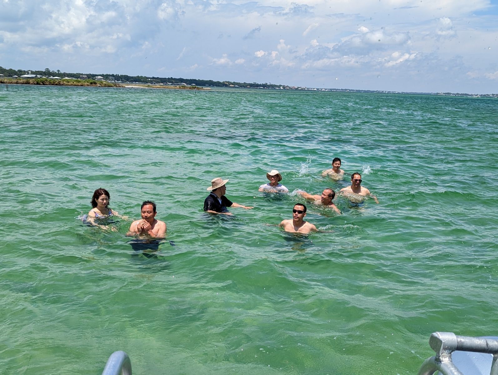 six people swimming in the ocean
