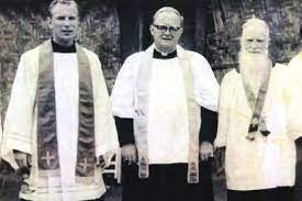 Bishop George Bernarding SVD standing with two other SVD priests