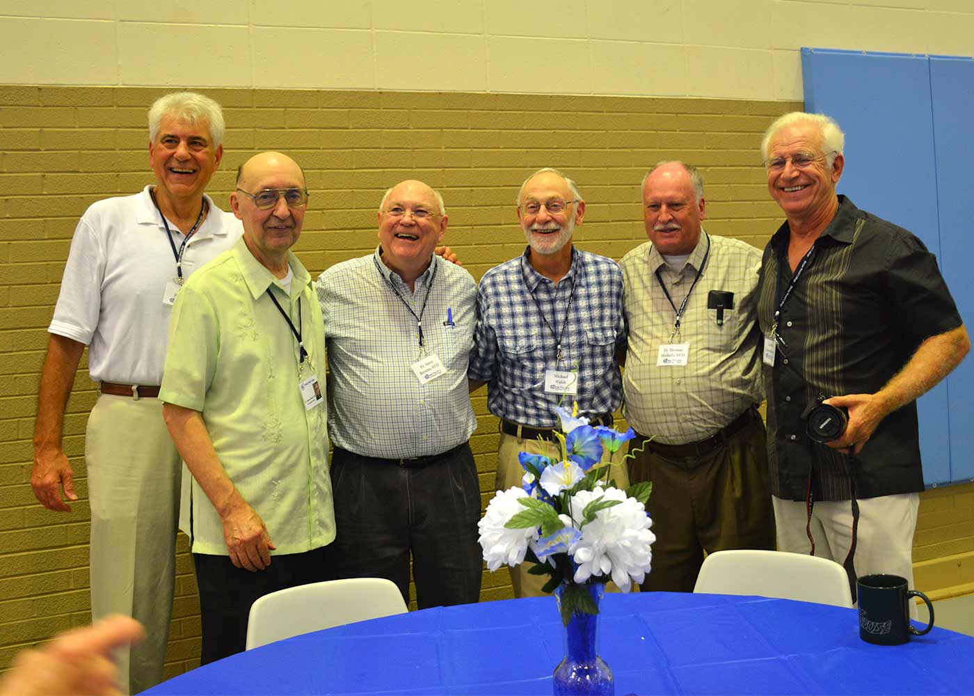 A group of Divine Word Alumni pose for a photo